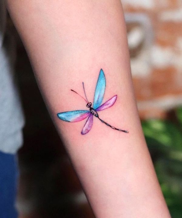 Adorable colored dragonfly tattoo by @sophie_suicide