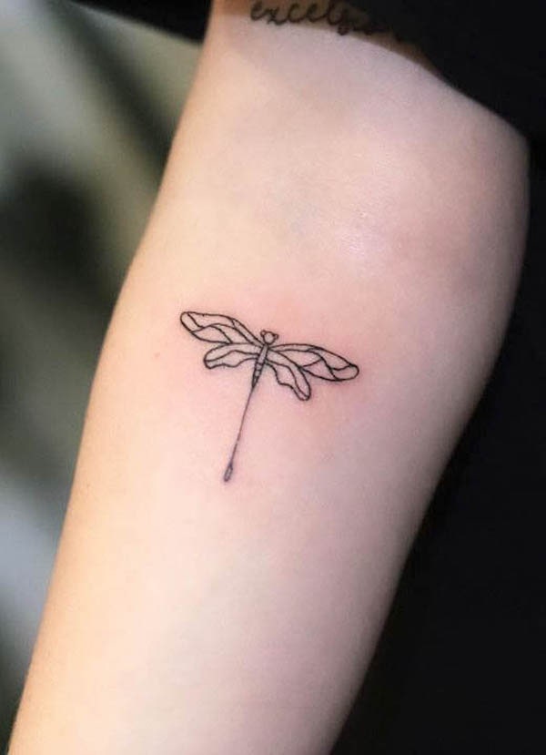 Tiny geometric dragonfly tattoo by @happysmilestattoo
